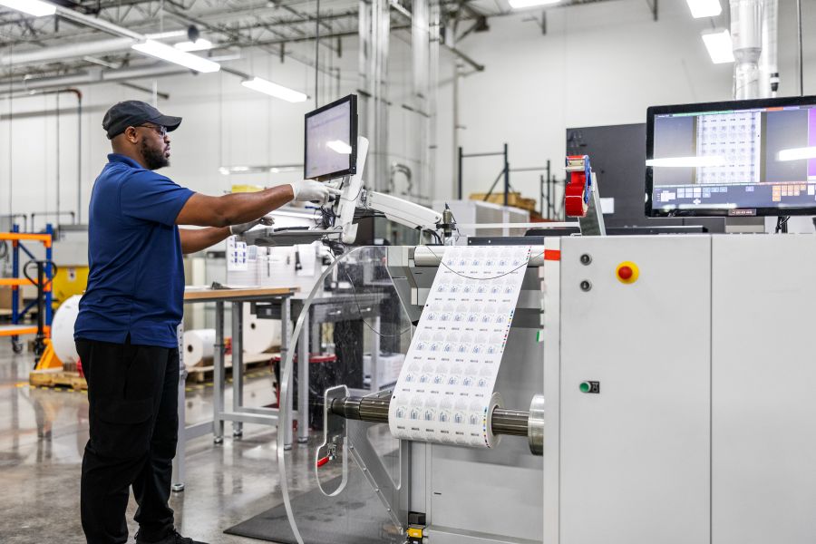 A person standing in a factory.